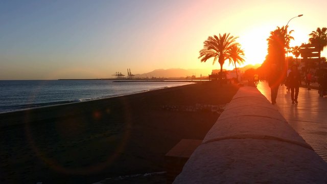 4K People walking along the seafront M&aacute;laga Spain