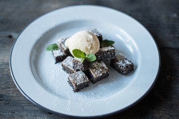 pie with ice cream on the wooden table