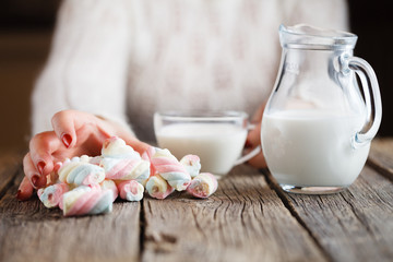 Woman give twisted marshmallow