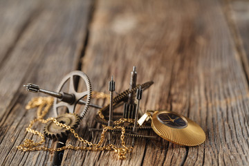 rusty mechanism from the old clock on the texture background/vin