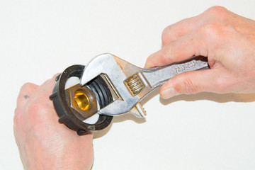 closeup the male hand spun nut spanner wrench