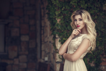Obraz na płótnie Canvas fashion outdoor photo of elegant beautiful woman with blond hair
