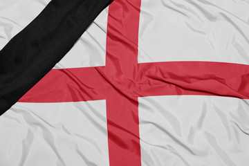 national flag of england with black mourning ribbon