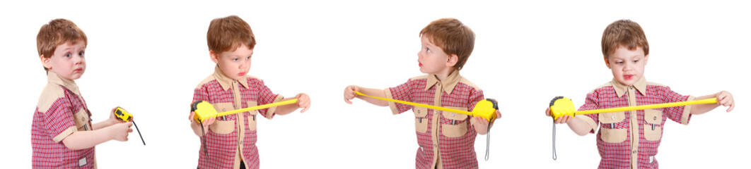 Little boy with measuring roulette on the white