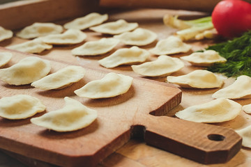 Vareniki (dumplings), pierogi before boiling - traditional Ukrainian food