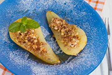 Pear baked with honey, curd cheese, walnuts