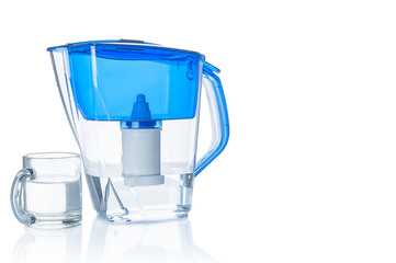 Water filter pitcher and glass on white background