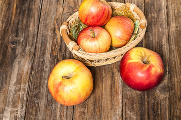 Ripe apples on wooden background