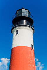 Vibrant picture of Red white and blue lighthouse