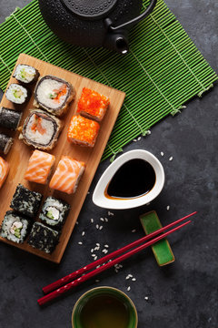 Set of sushi and maki roll and green tea