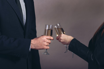 man and woman celebrating with Champagne, toast, party time