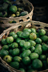 Raw mango in weaving basket