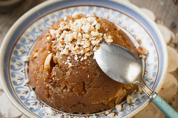 
semolina halva, halvah, halava sweet desert with raisiins and nuts