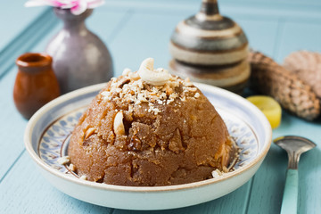 
semolina halva, halvah, halava sweet desert with raisiins and nuts