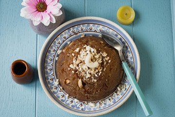 
semolina halva, halvah, halava sweet desert with raisiins and nuts