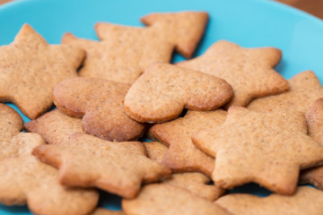 Tasty homemade ginger cookies on a blue plate