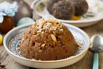 
semolina halva, halvah, halava sweet desert with raisiins and nuts