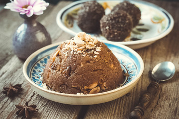 
semolina halva, halvah, halava sweet desert with raisiins and nuts