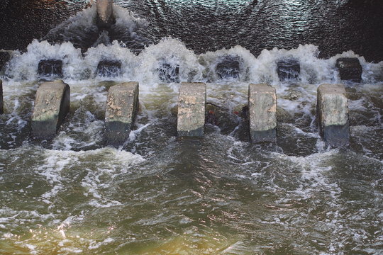 Turbulent  flow of water pass a weir after the rain