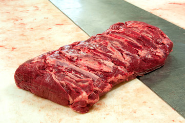 Raw roast beef close up in butchery