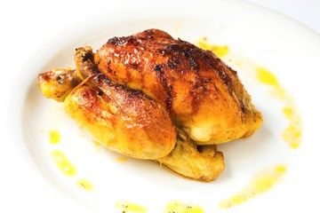 Whole grilled chicken on white background