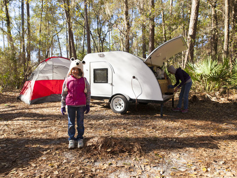 Little Girl Camping With Teardrop Trailer