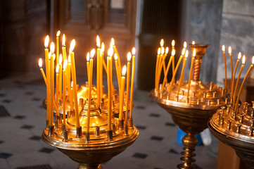 burning candles in a church