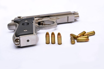 Automatic handgun pistol with magazine and bullets on white background