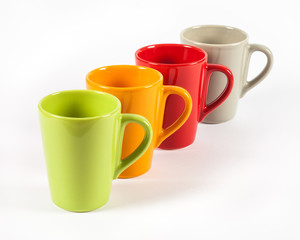 Four color tea cups shown in row