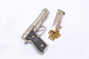 Automatic handgun pistol with magazine and bullets on white background