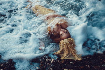 Mermaid in the ocean waves