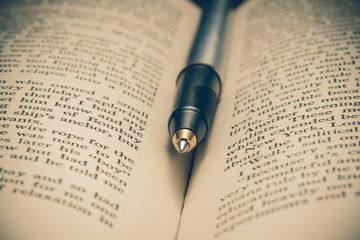 pen and book with filter effect retro vintage style