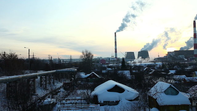 Pan on industrial view at sunset  in winter
