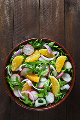 Salad with arugula, radish,red onion and tangerine