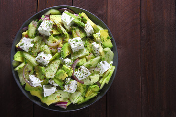 Salad with avocado, cucumber,cheese and red onion