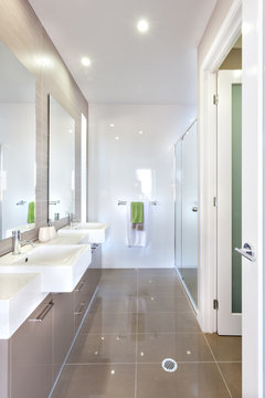 Modern bathroom with set of washstands and bathroom
