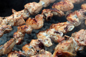 Chicken on the grill to cook