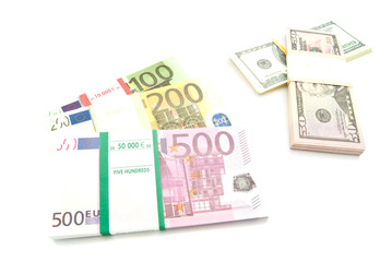 Obraz na płótnie Canvas packs of euro and dollars banknotes