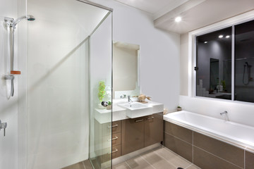 Fototapeta na wymiar New bathroom with washing area, including bath tub