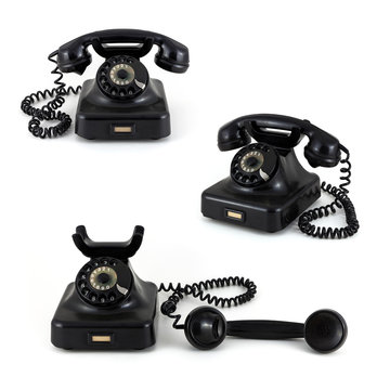 Three old telephones on a white background