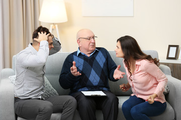 Young couple with problem on reception for family psychologist