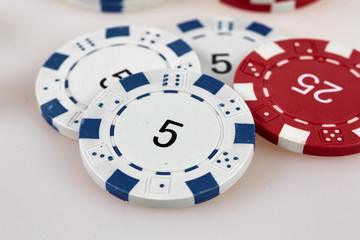 Casino chips on a white table