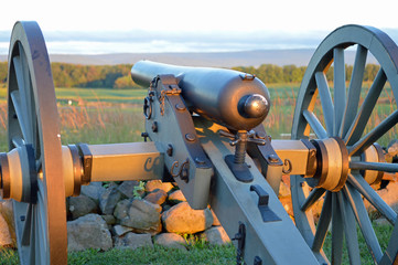 Gettysburg Cannon pointing toward the battlefield at sunrise in Pennsylvania.