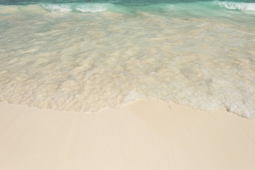 Fototapeta na wymiar Beautiful water splash on white sandy