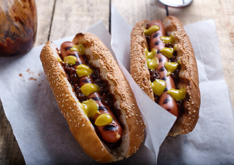 Grilled Hot Dog with cola on wood background