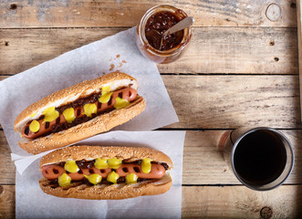 Grilled Hot Dog with cola on wood background