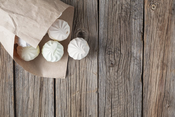 Pile of pastrel colored marshmallow on wooden table