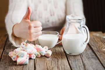 Woman give twisted marshmallow