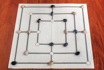 Traditional board for playing Nine Men's Morris game