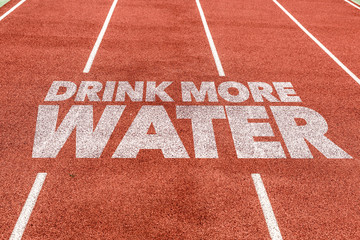 Drink More Water written on running track